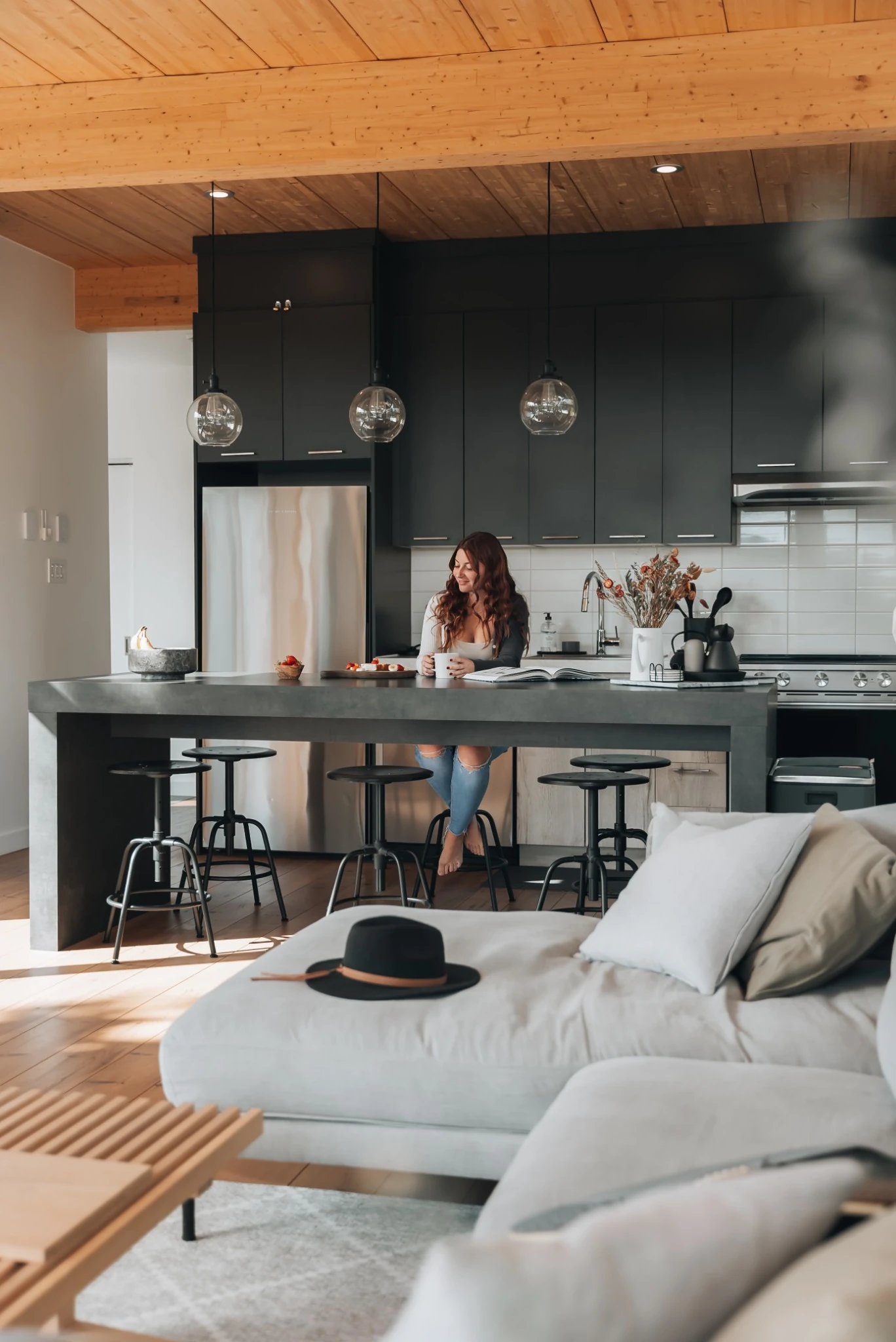 Fully equipped kitchen and bar-style dining area at WOLM Cabin