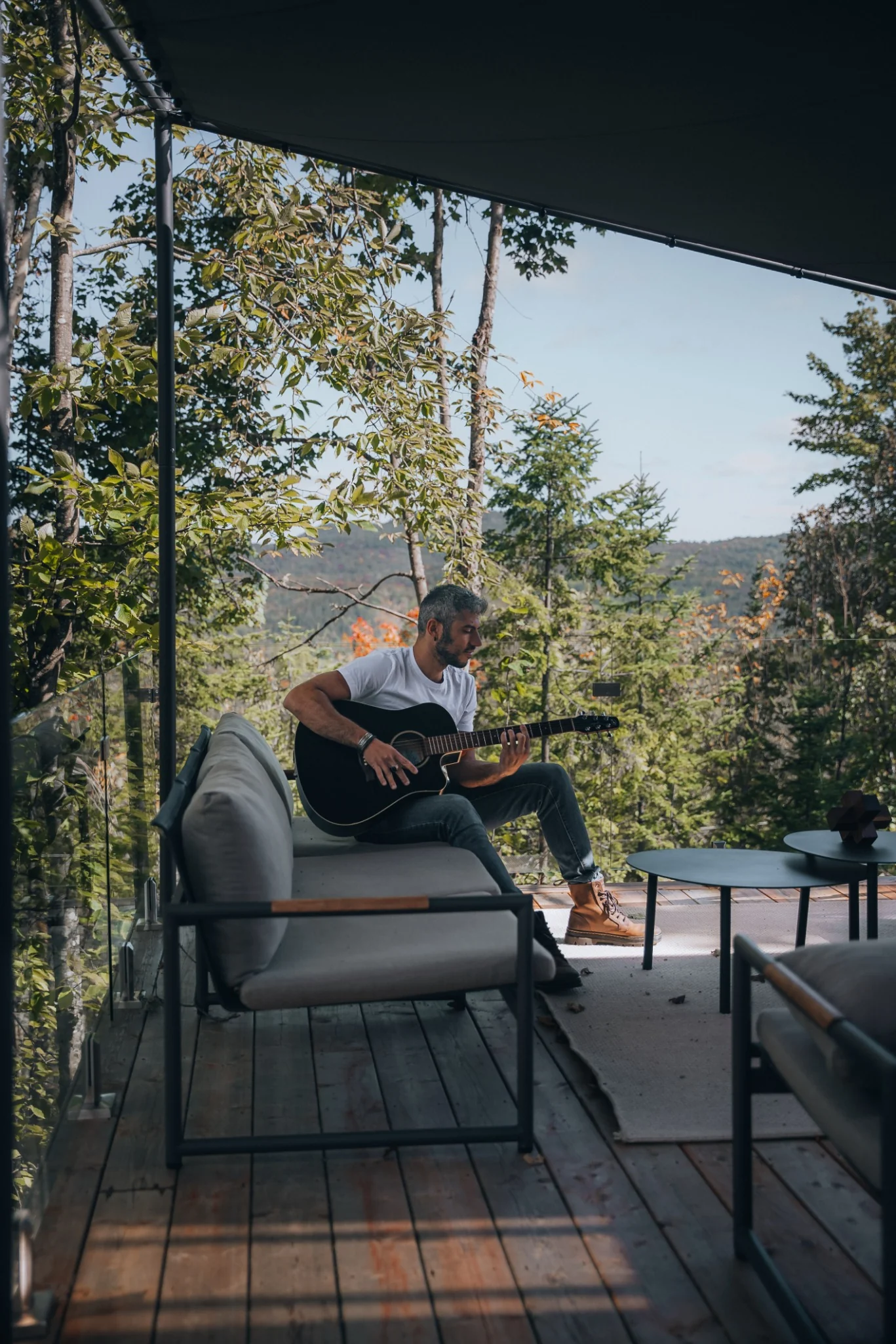 Outdoor living room on the WOLM Cabin deck overlooking the forest
